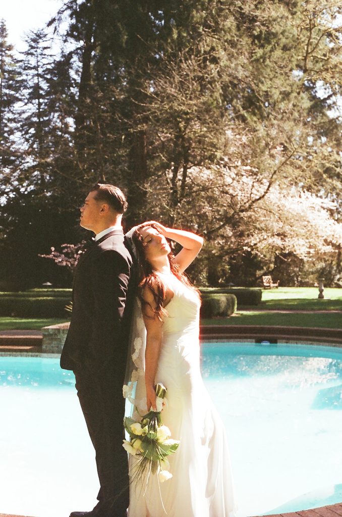 Carly and Gary photographed on CineStill 400D near the Lakewold Gardens pool.