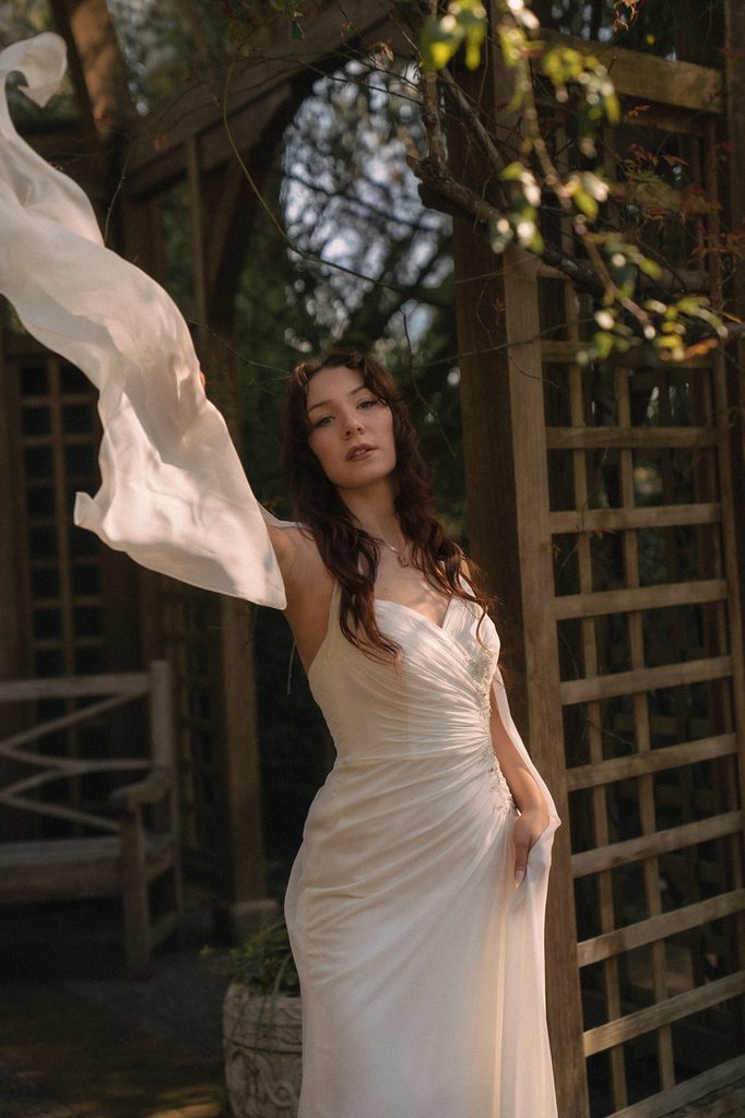 Bride posing for photos at the Tea House Gazebo for her Lakewold Gardens wedding photos in Lakewood, Washington.